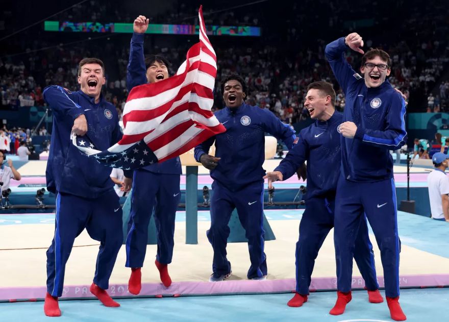 Members of the U.S. gymnastics team, Brody Malone, Asher Hong, Frederick Richard, Paul Juda and Stephen Nedoroscik celebrate winning bronze medal.